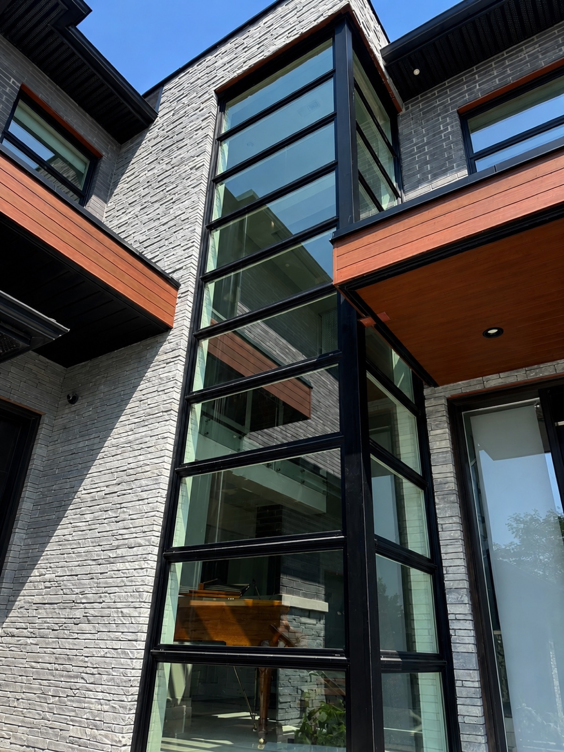 Floor-to-ceiling modern glass, spotless
