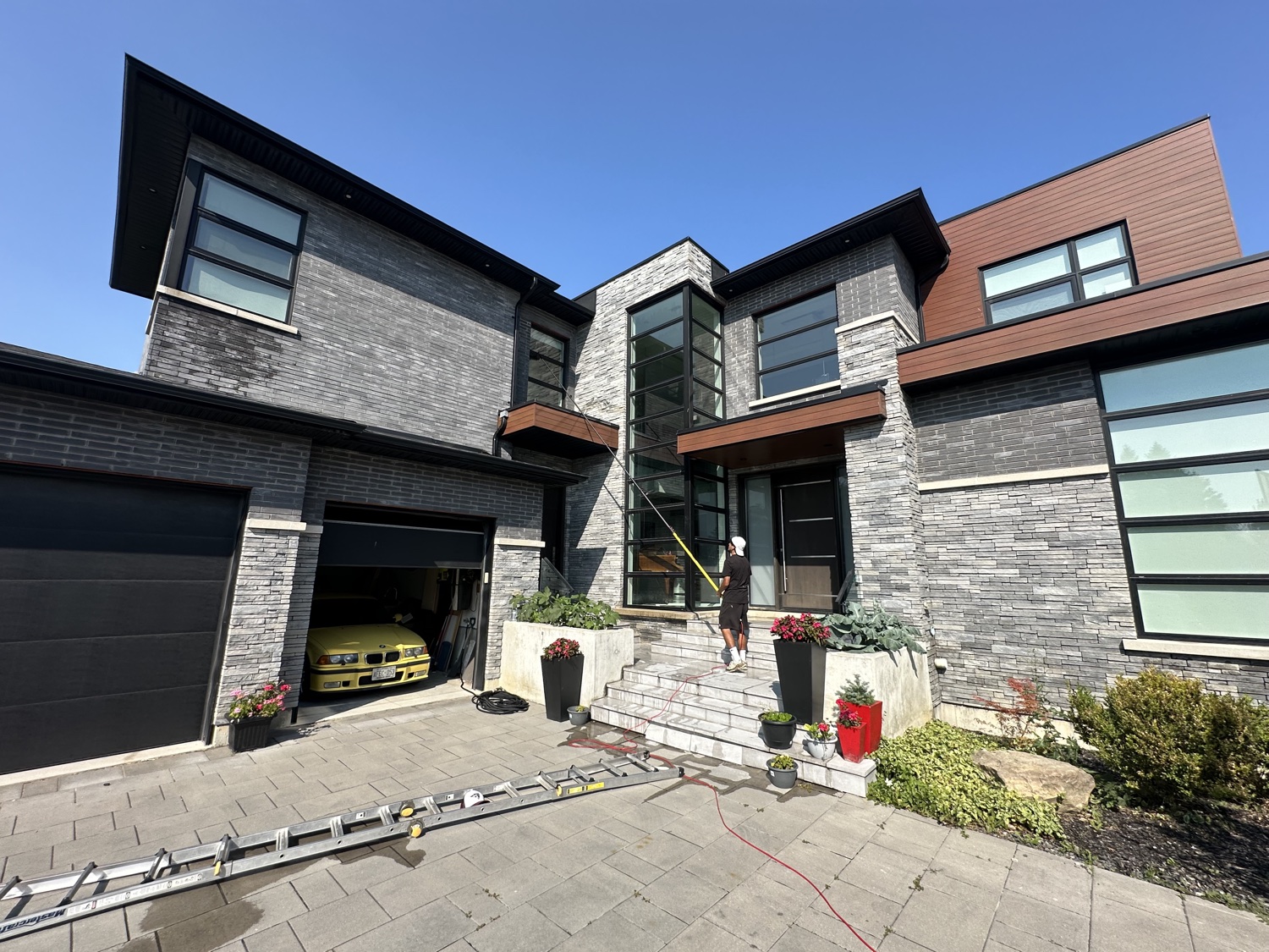 Cleaning a modern estate's tall windows