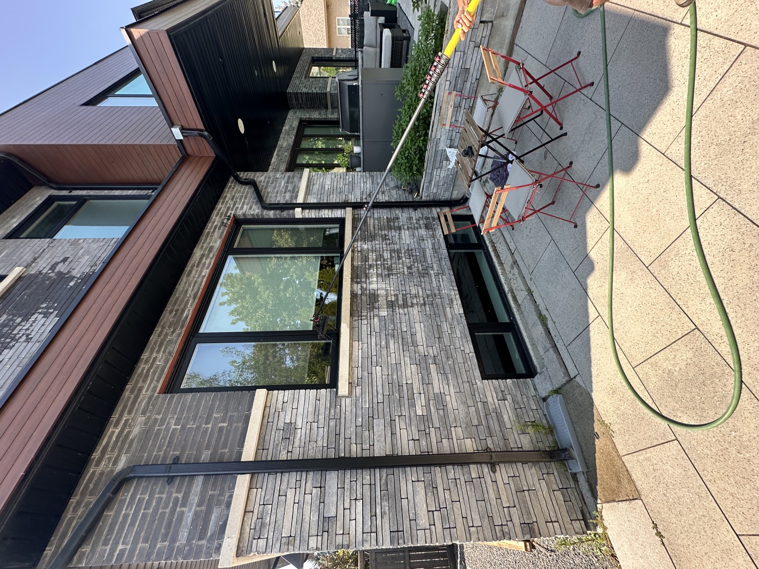 Reaching high windows with a water-fed pole