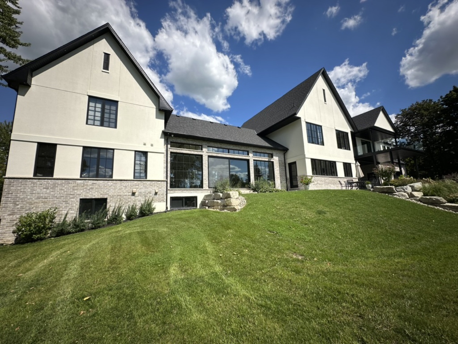 Backyard of a large home with spotless glass
