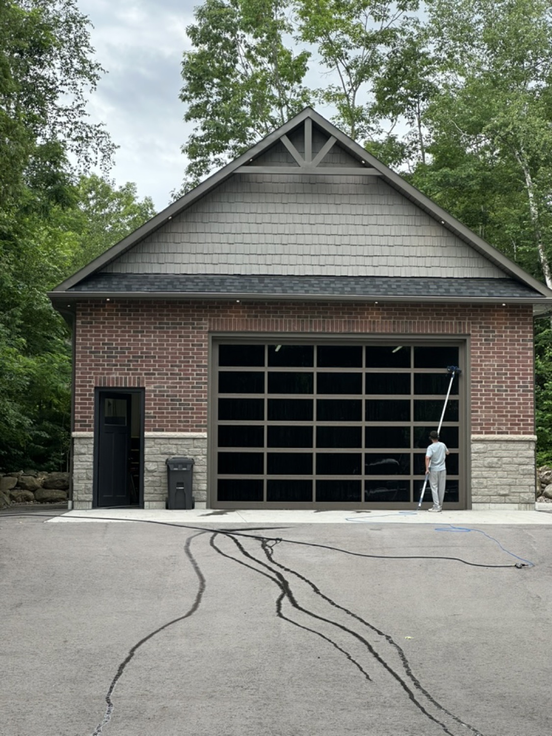 Cleaning the glass doors of a detached garage