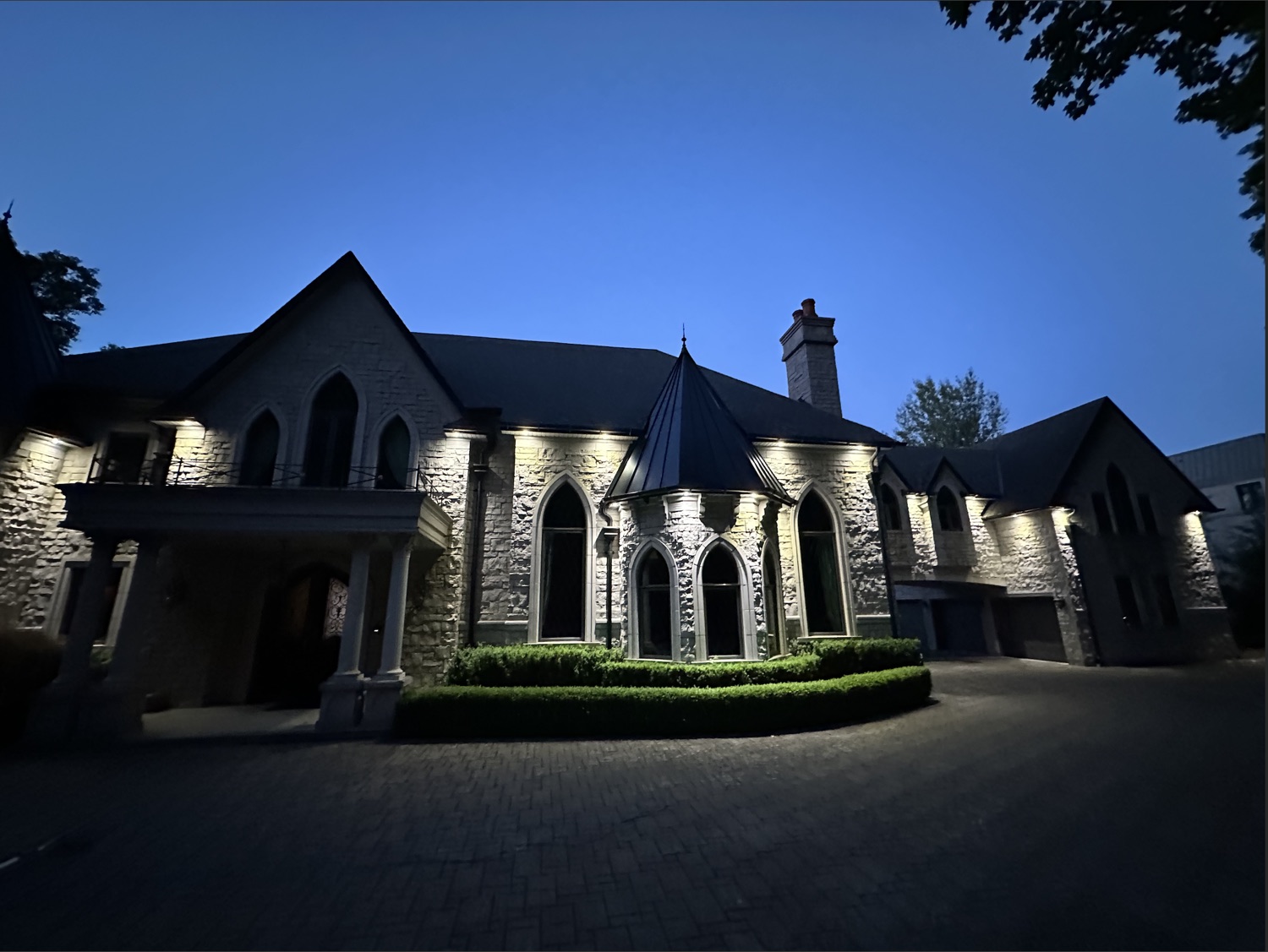 Grand stone estate at dusk