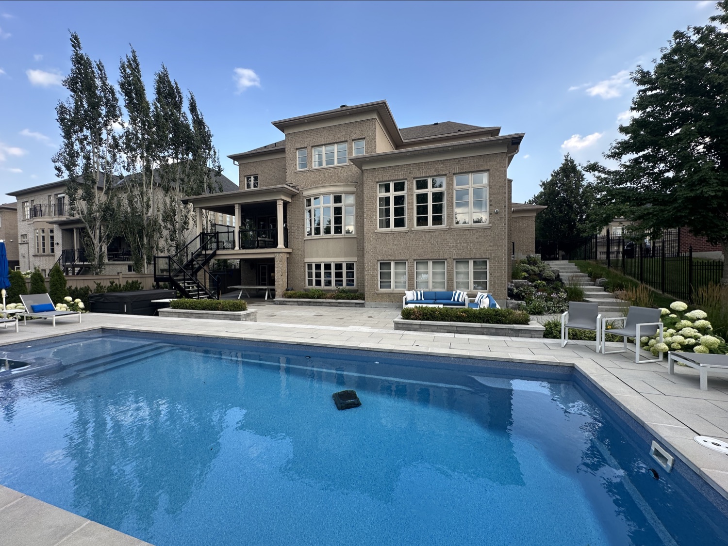 Large family home with a pool and clean windows